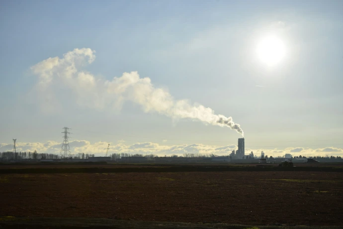 A factory with smoke coming out of it's stacks